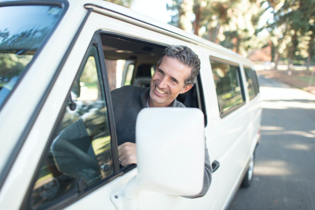 Man leaning out of white van in South Holland, IL